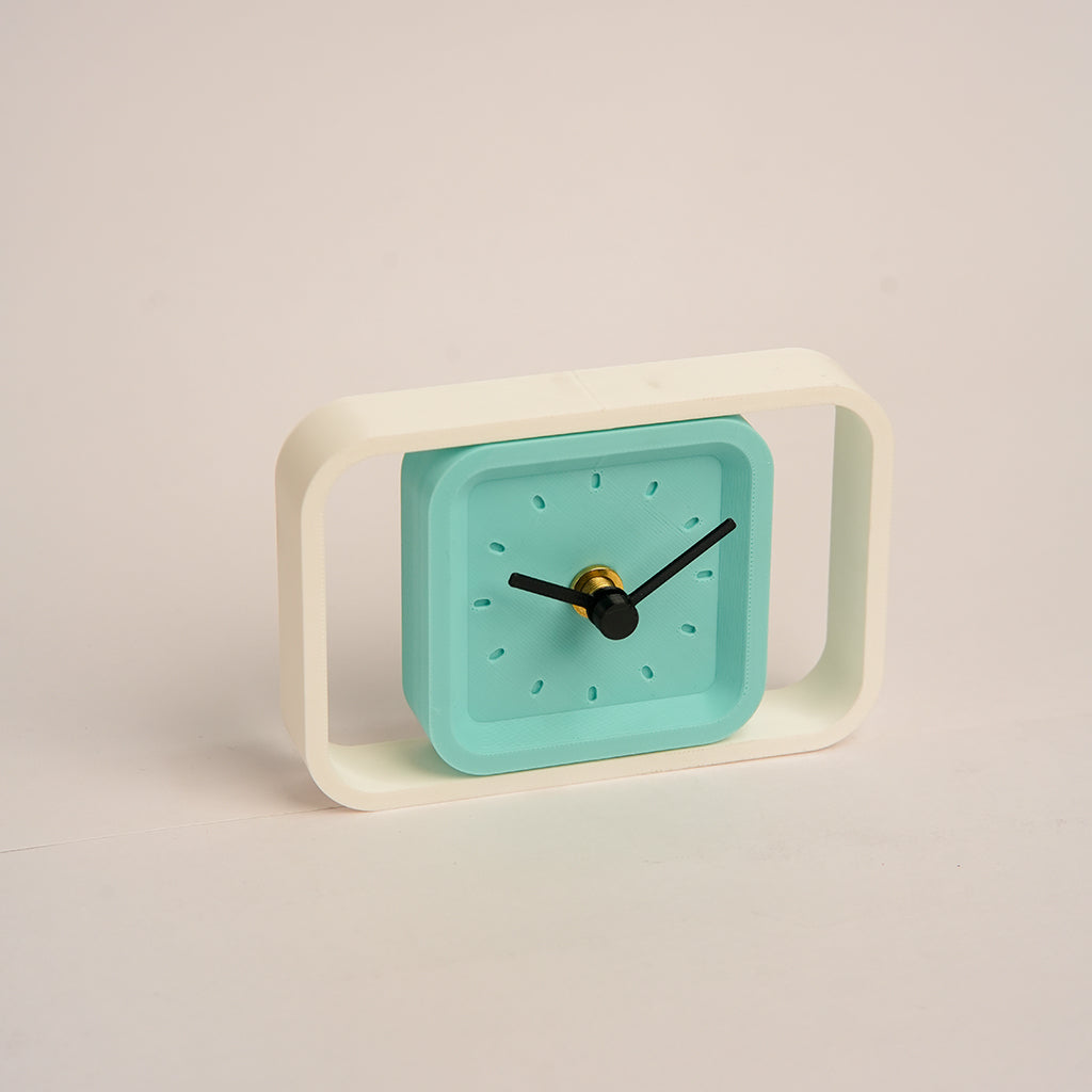 Compact SpinFrame teal and white desk clock for stylish interiors