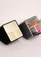 Stylish angled desk organizer with four compartments, holding colorful pens and markers, ideal for office or home workspace organization.