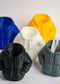 Five silicone hoodie-shaped molds in different colors with a gray mold containing pens.
