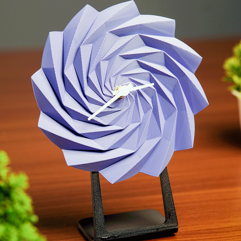 LayerStory Twist Bloom Desk Clock in purple with geometric swirl design